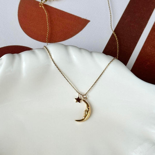 Gold crescent pendant star charm necklace