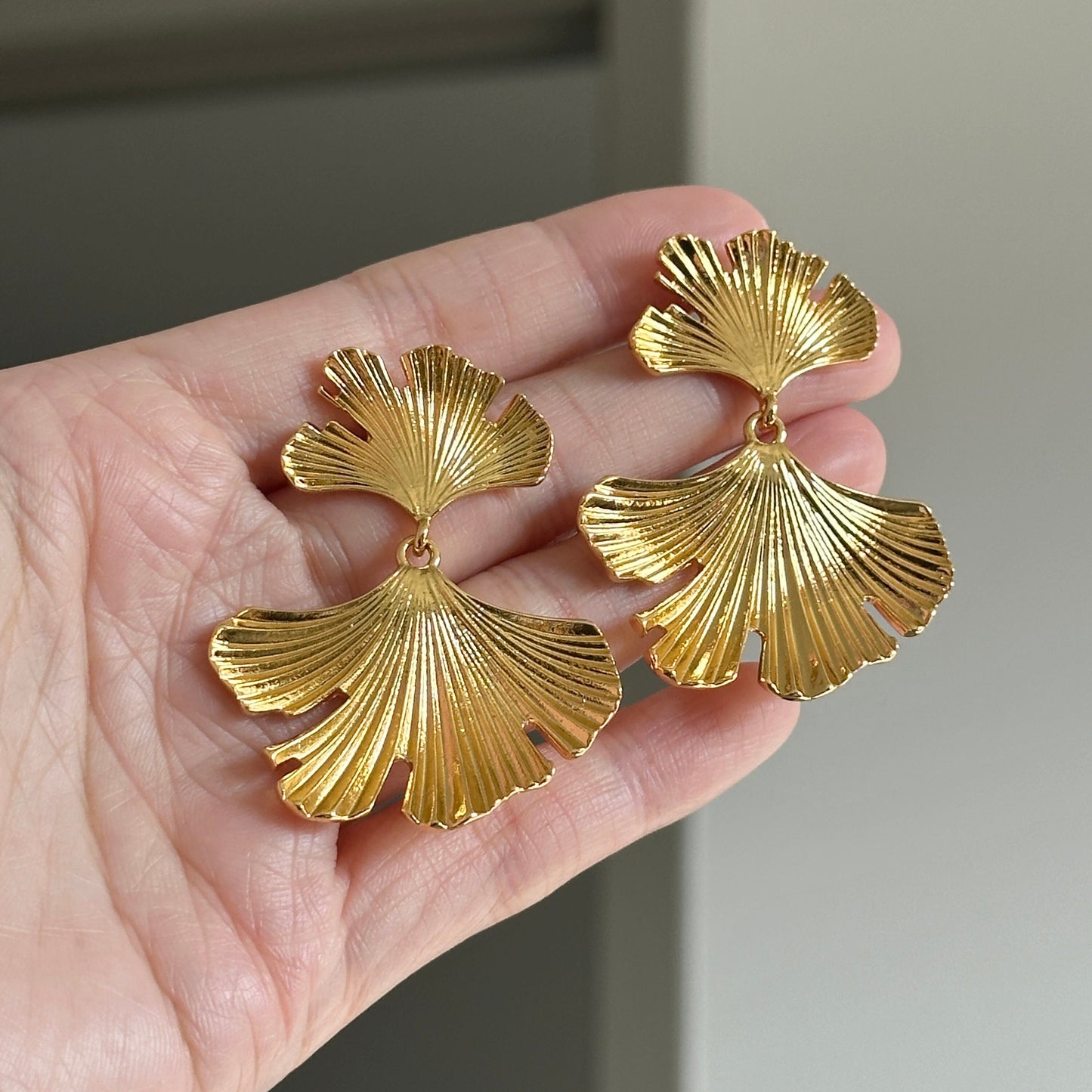 Elegant gold ginkgo leaf statement earrings