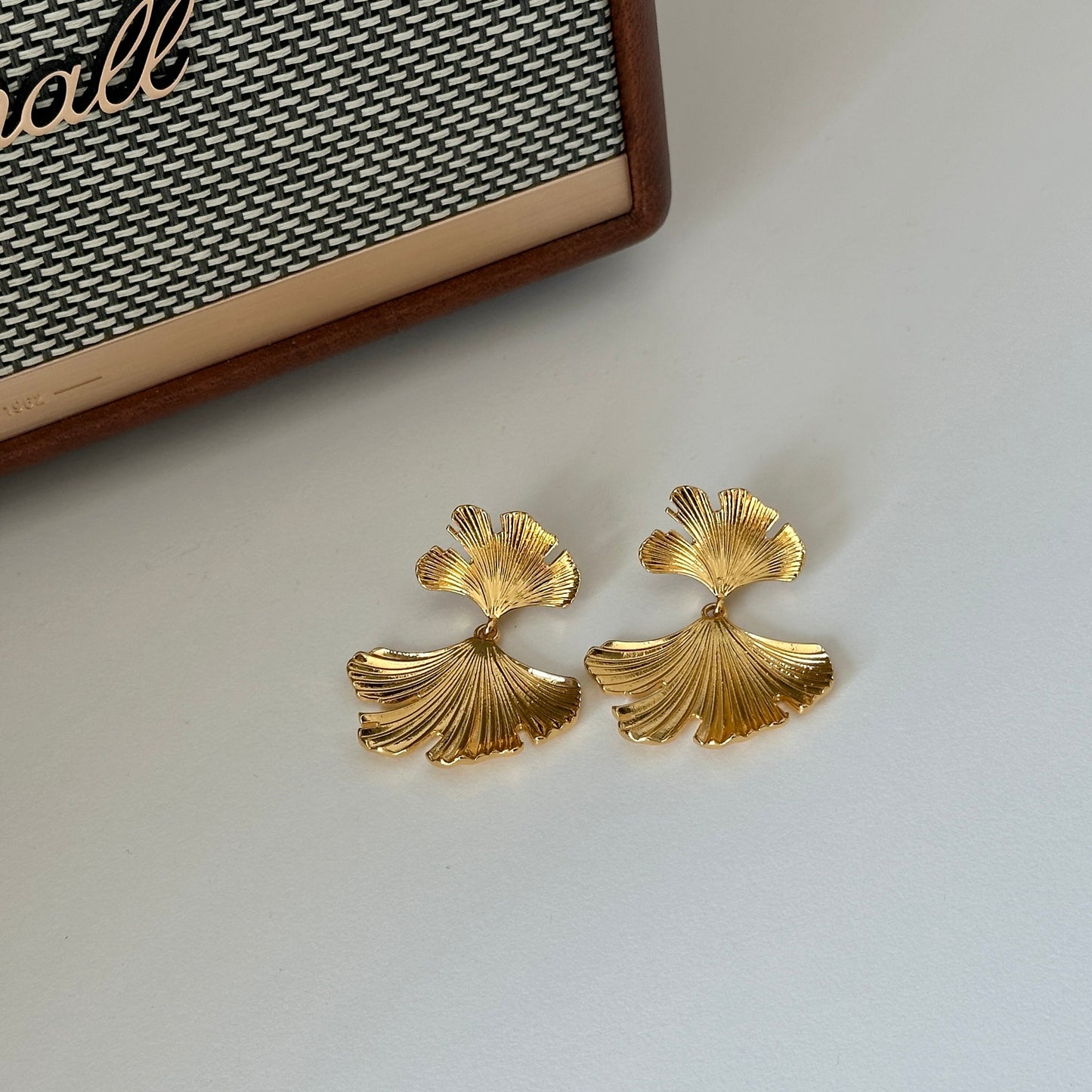 Elegant gold ginkgo leaf statement earrings