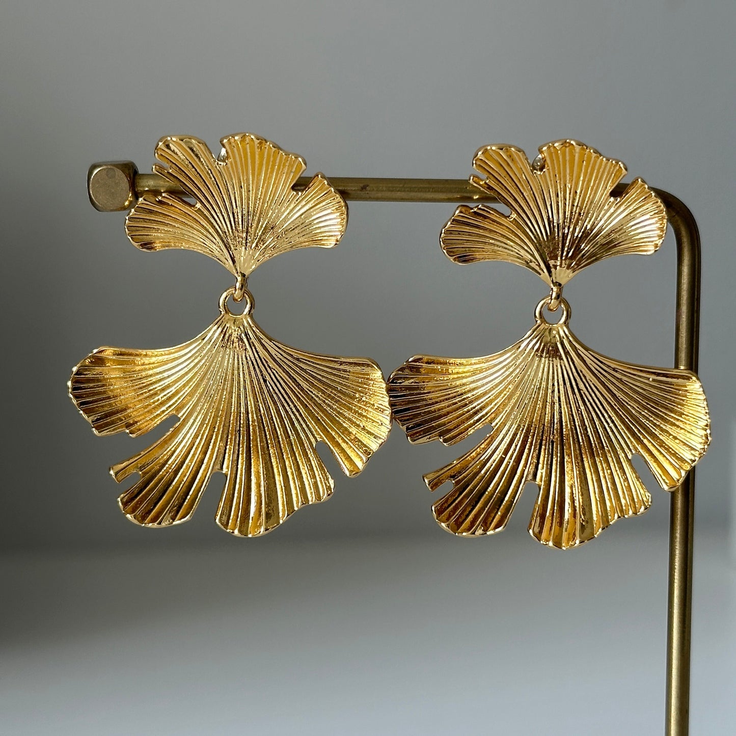 Elegant gold ginkgo leaf statement earrings