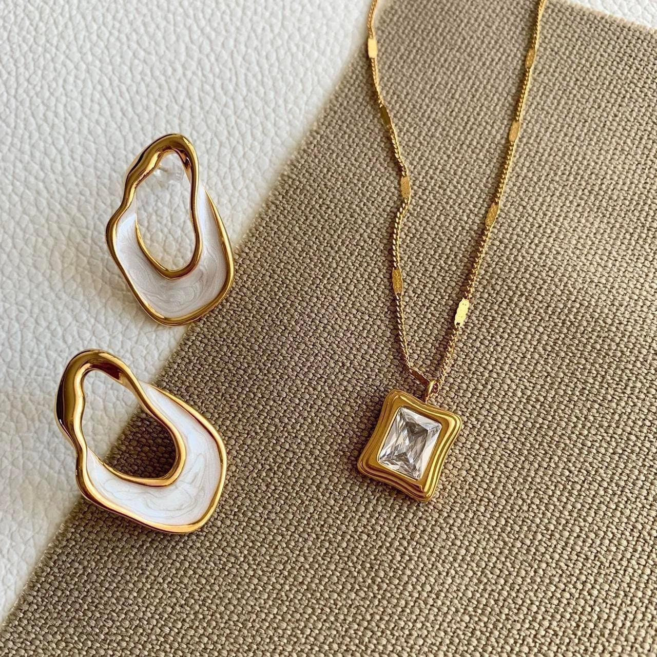 White and gold enamel irregular hoop earrings