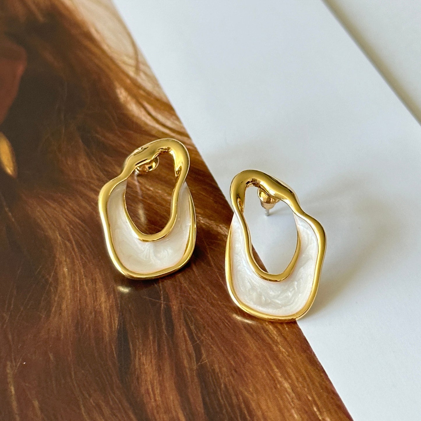White and gold enamel irregular hoop earrings