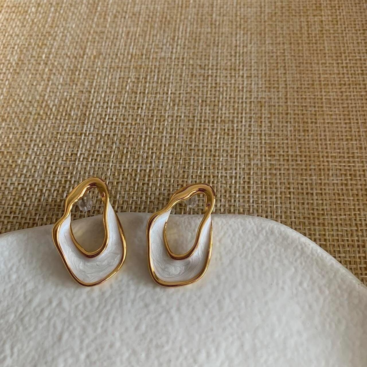White and gold enamel irregular hoop earrings