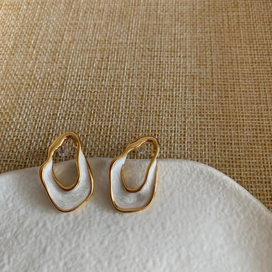 White and gold enamel irregular hoop earrings