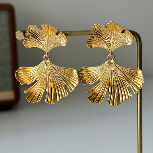 Elegant gold ginkgo leaf statement earrings