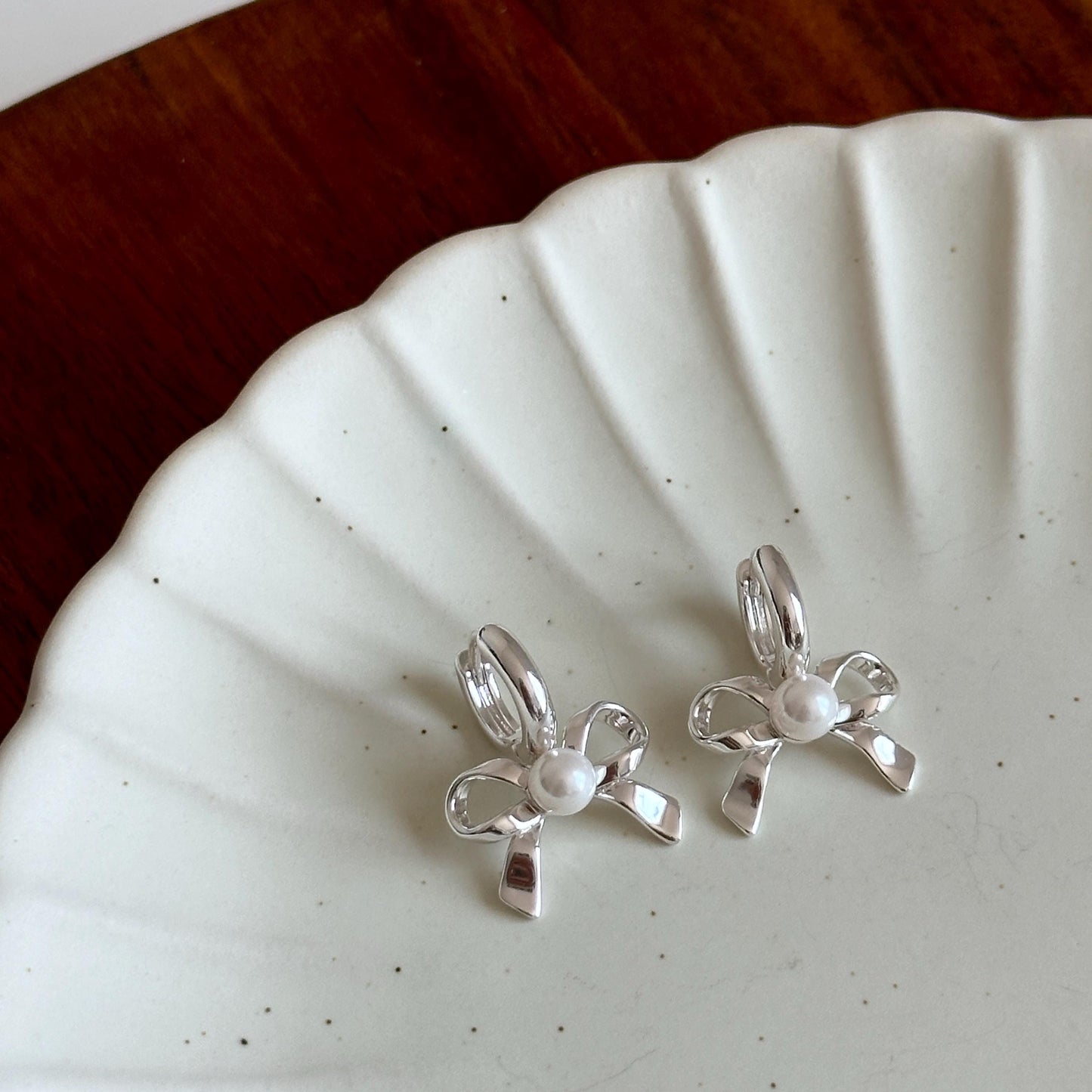 Bow Pearl Huggies Earrings