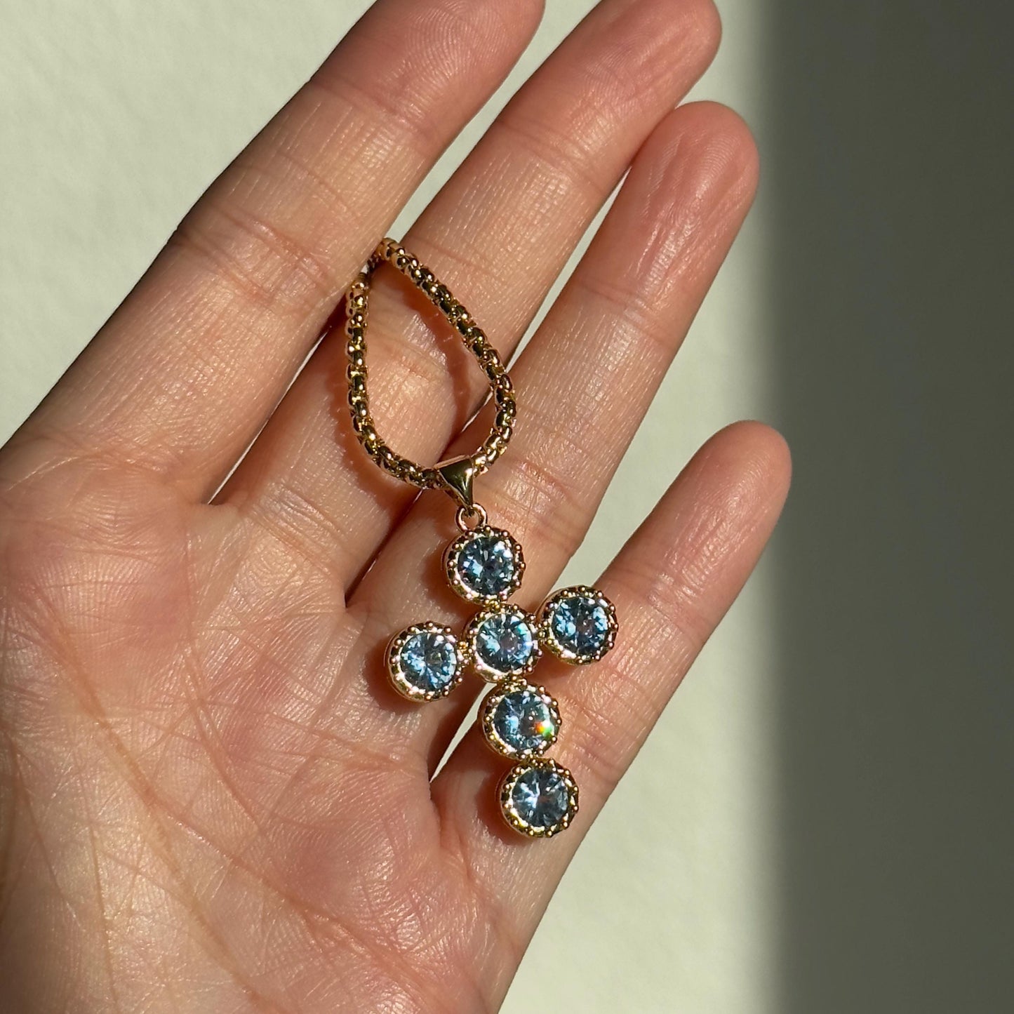 Gold Cross Pendant Necklace with Blue Gemstones
