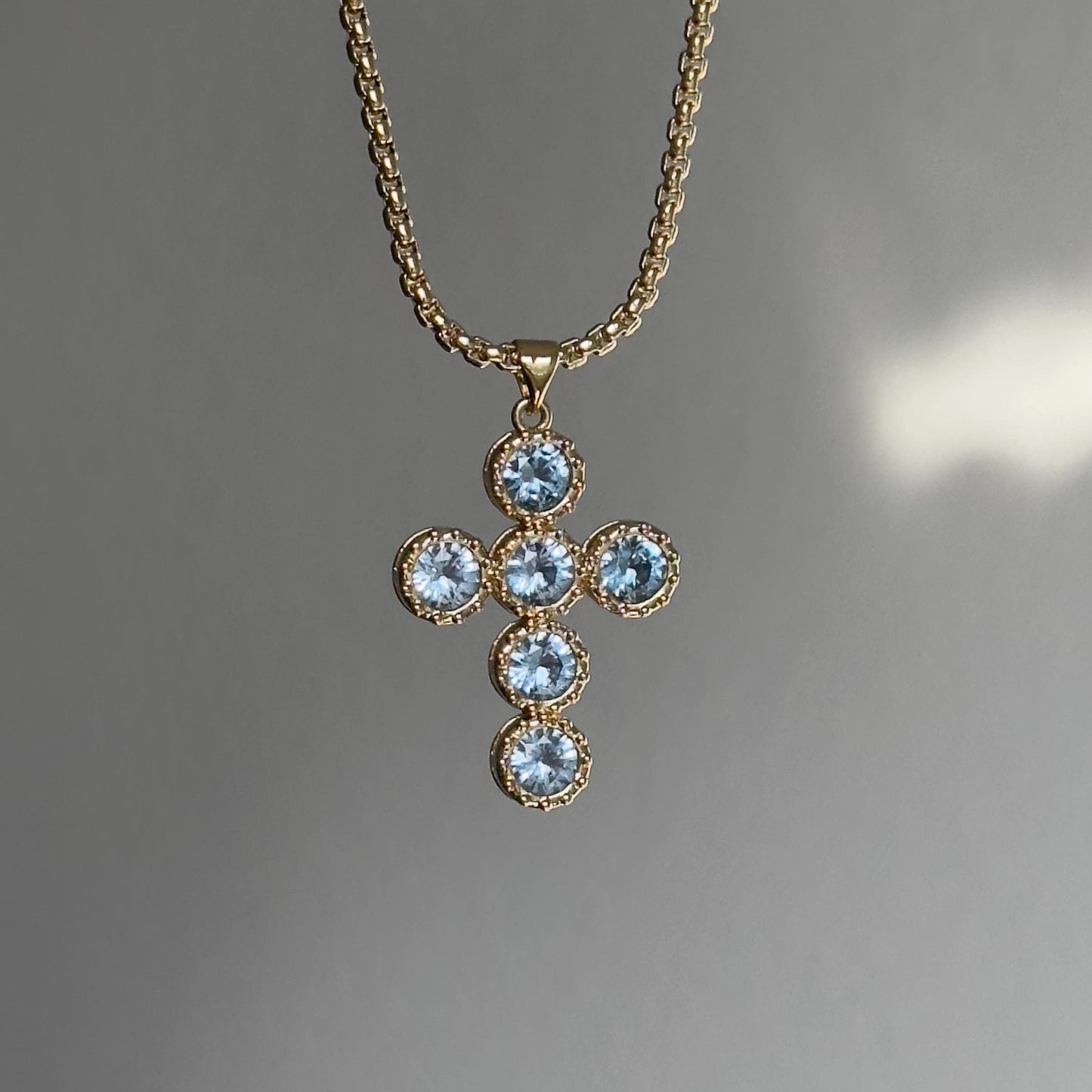 Gold Cross Pendant Necklace with Blue Gemstones